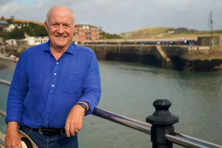 Rick Stein stood by a harbour