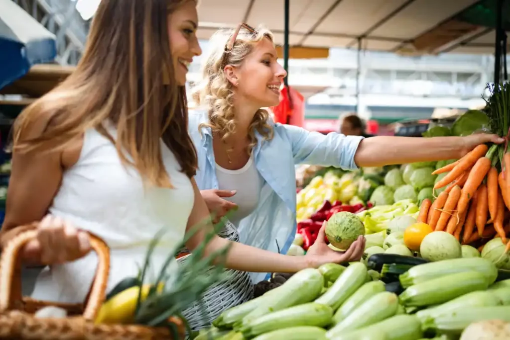Women shopping at a farmers market