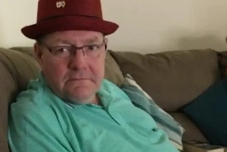 Gary Piatek sitting on a couch.