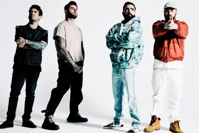 adaytoremember Four individuals posing in casual attire.