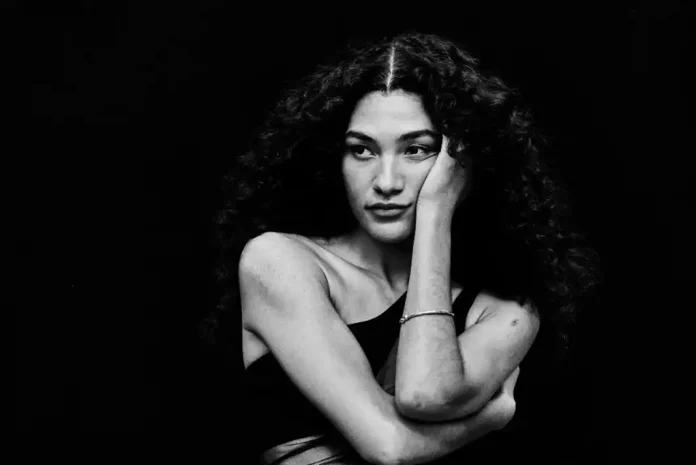 oliviadean Person with curly hair in shadows