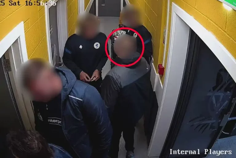 A man attempts to enter the away changing room at Worksop Town FC