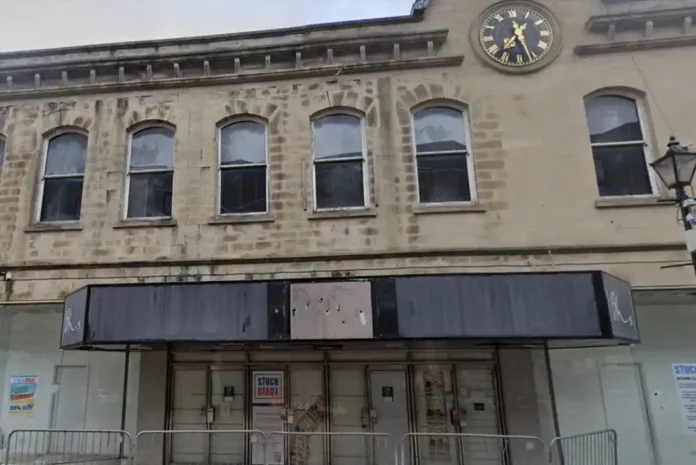 Abandoned building with boarded windows
