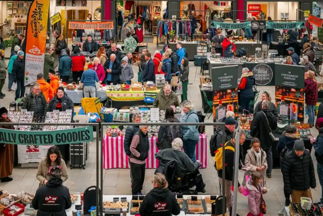 Busy market with various vendors.