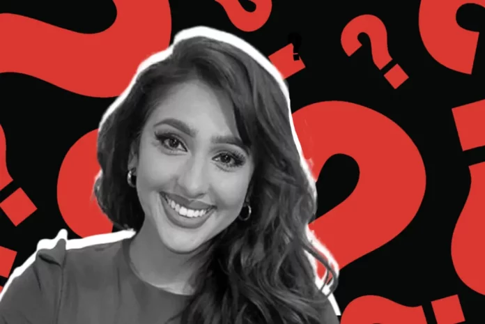 Smiling Monika Plaha with question marks background