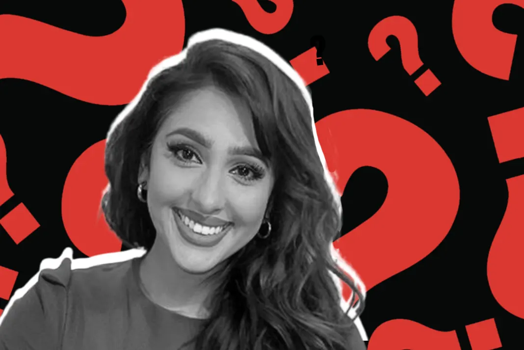 monika Smiling Monika Plaha with question marks background