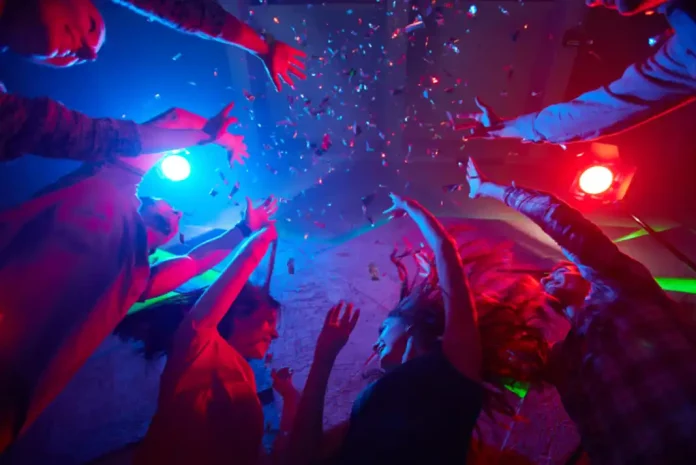 People celebrating with confetti and lights