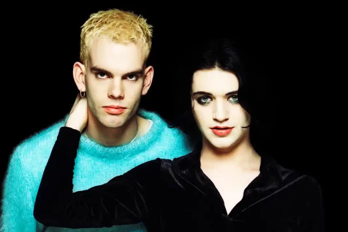 Placebo band photo showing Two blurred figures against black background