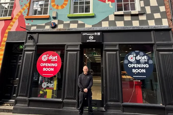 Storefront with colorful mural and signage