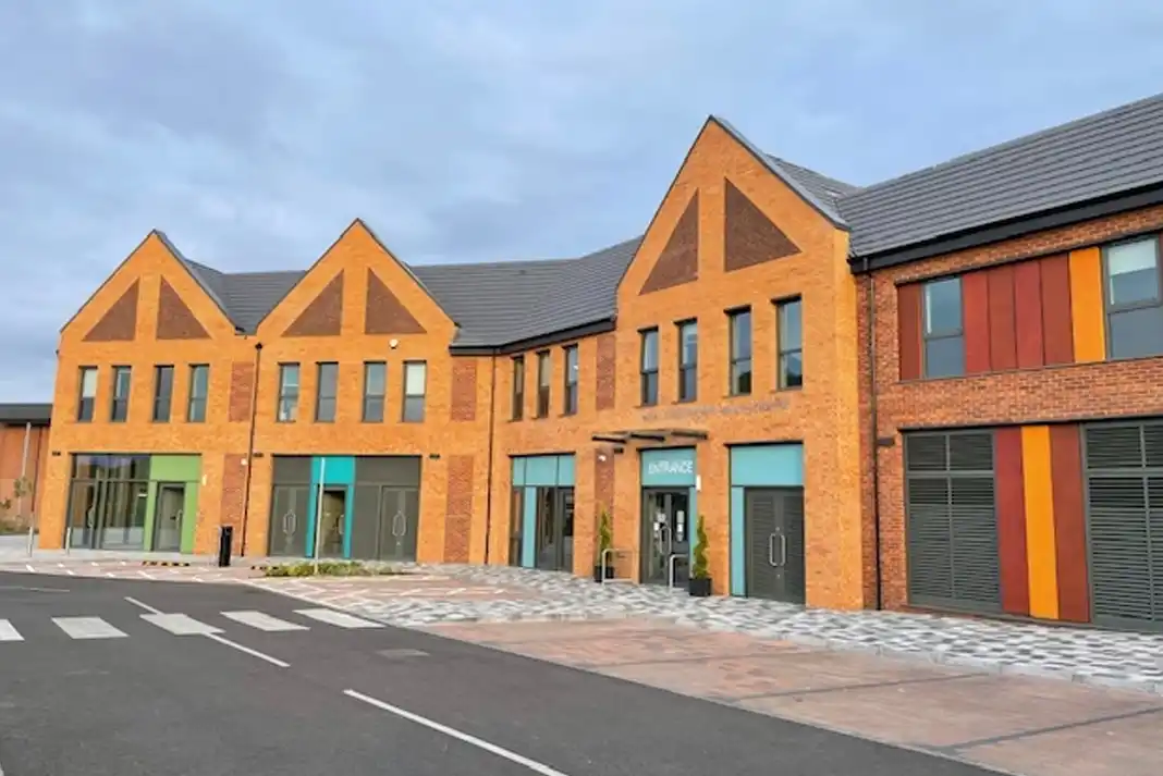 Modern brick building with colorful accents.