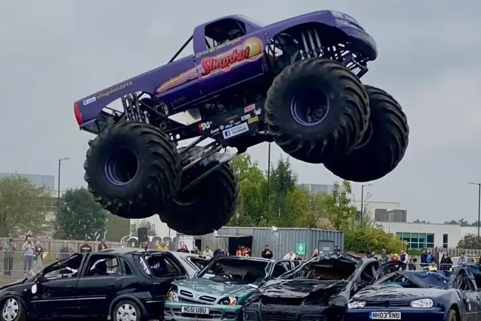Monster truck jumping over cars