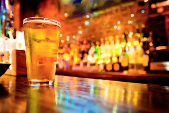 Glass of beer on bar counter