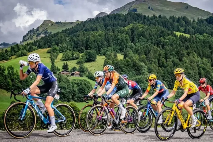 Women cyclists racing in mountainous landscape