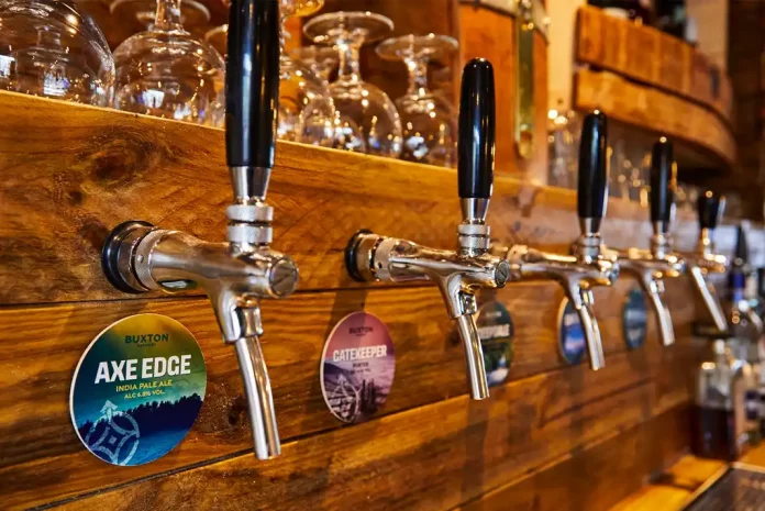 Beer taps on wooden bar counter
