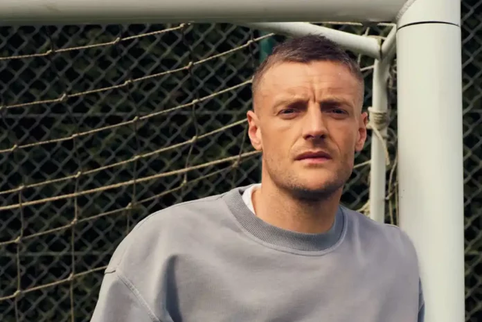 Jamie Vardy posing near soccer goal.